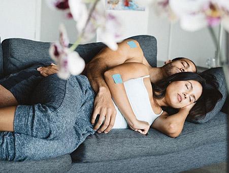 Couple napping with the Klova Sleep ZPatch